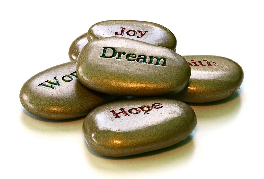 Closeup of message stones on white background.